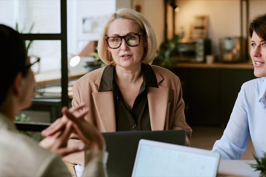 Colleagues in conversation during a meeting